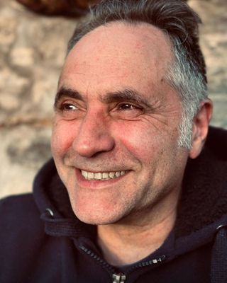 Portrait of Julian Danobeitia in warm natural light